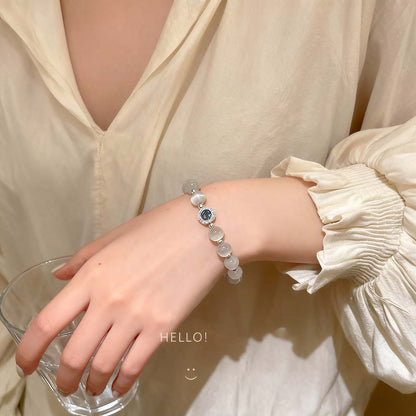 Pulsera de cuentas de ojo de gato y plata aplastada, ligera de lujo, delicada y exclusiva, accesorio de moda para mujeres con estilo, versátil y de alta gama.